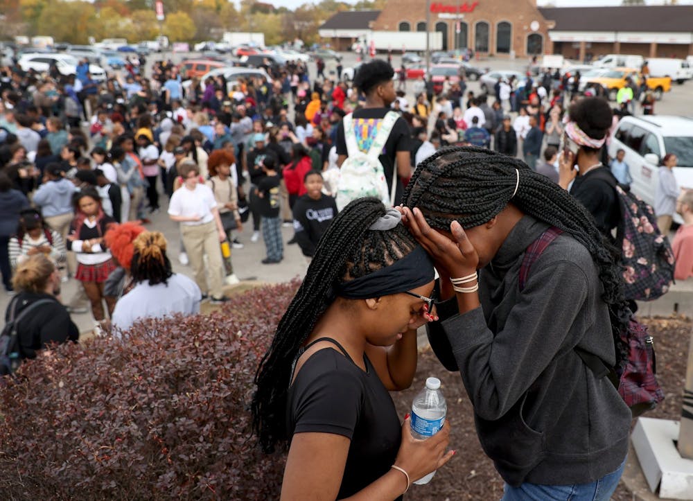 High School students were evacuated to the Schunks parking lot from the Central Visual & Performing Arts High School after a reported shooting at the school in in south St. Louis on Monday, Oct. 24, 2022. (David Carson/St. Louis Post-Dispatch/TNS)