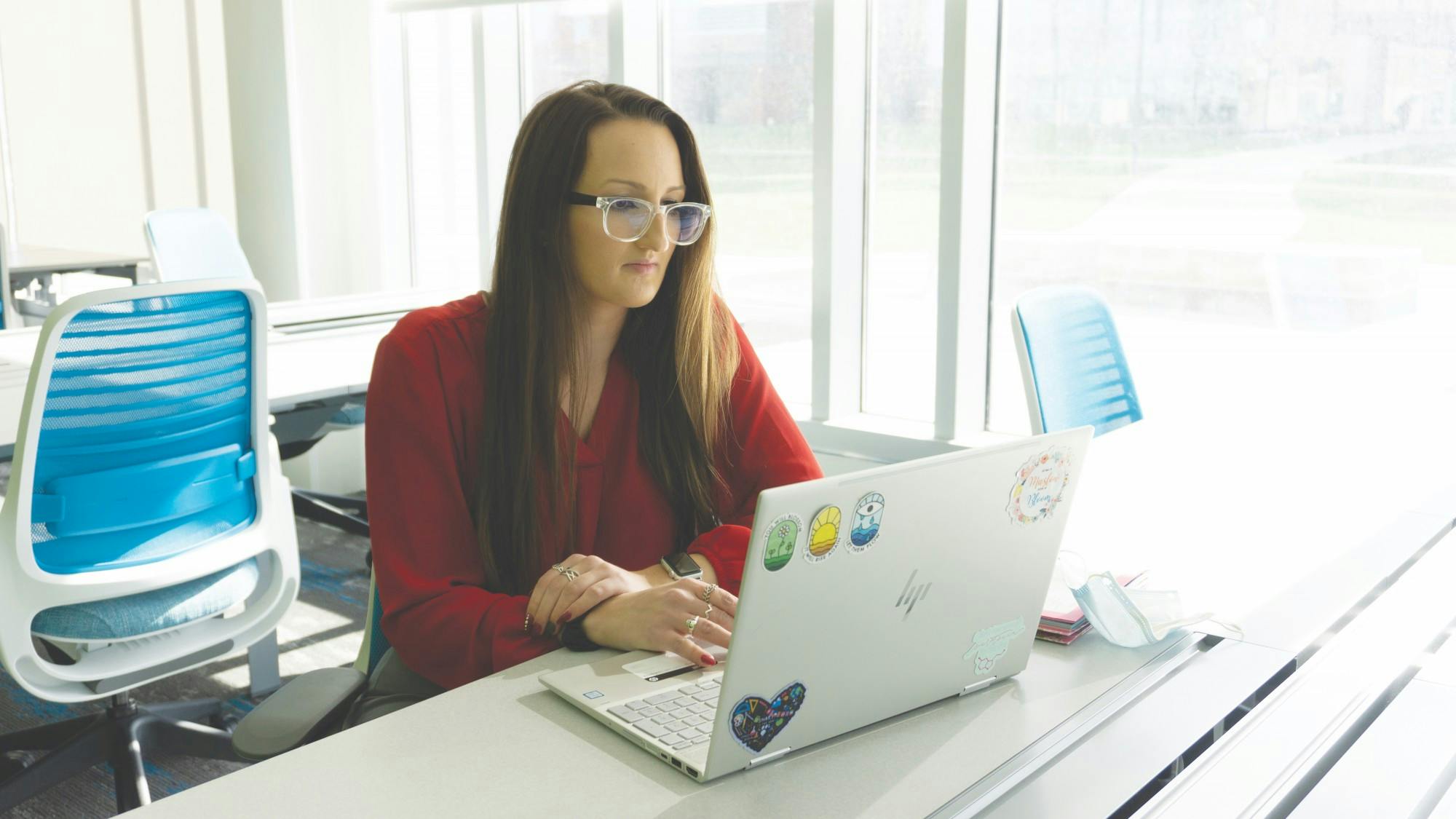 Malorie McLain, Ball State psychology graduate student, sits at a desk in the Health Professions Building Nov. 29. McLain hopes to use her training in rehabilitation counseling to help people with chronic illnesses and disabilities after she completes Ball State&#x27;s PhD program. John Lynch, DN