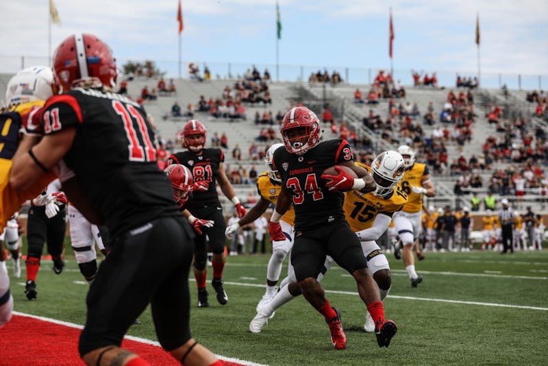 Redshirt junior running back James Gilbert runs around Kent State players to score a touchdown Sept. 28, 2018, at Scheumann Stadium. Gilbert scored two touchdowns during the game. Rebecca Slezak,DN