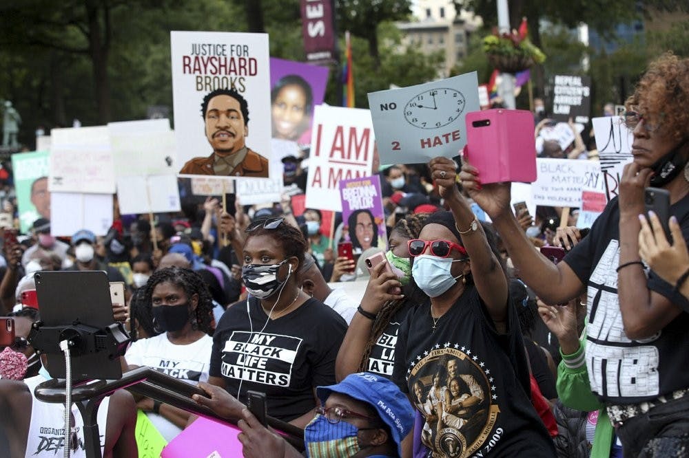 A crowd of demonstrators march to the Capitol. The NAACP March to the Capitol coincided with the restart of the Georgia 2020 General Assembly Monday, June 15, 2020 in Atlanta. (Steve Schaefer/Atlanta Journal-Constitution via AP)