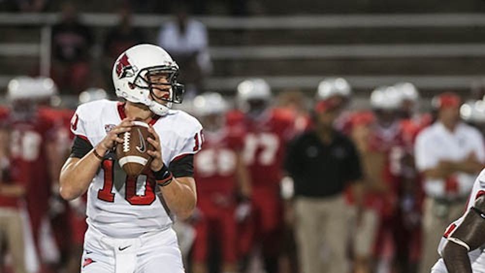 Quarterback Keith Wennning searches for an open player during the first home game against Illinois State on Aug. 29. Ball State is looking to limit the amount of sacks against Wenning for Saturday’s game against Army. DN FILE PHOTO JONATHAN MIKSANEK