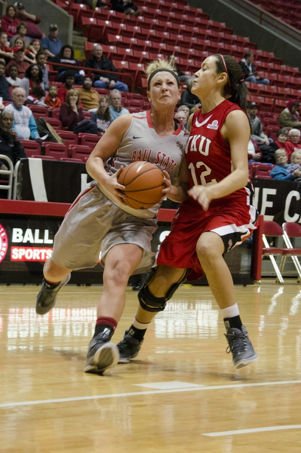 Freshman guard Jill Morrison takes the ball for a layup past Western Kentucky's Kendall Noble in the first half Dec. 7 at Worthen Arena. Morrison had 26 points in the game. DN PHOTO BREANNA DAUGHERTY