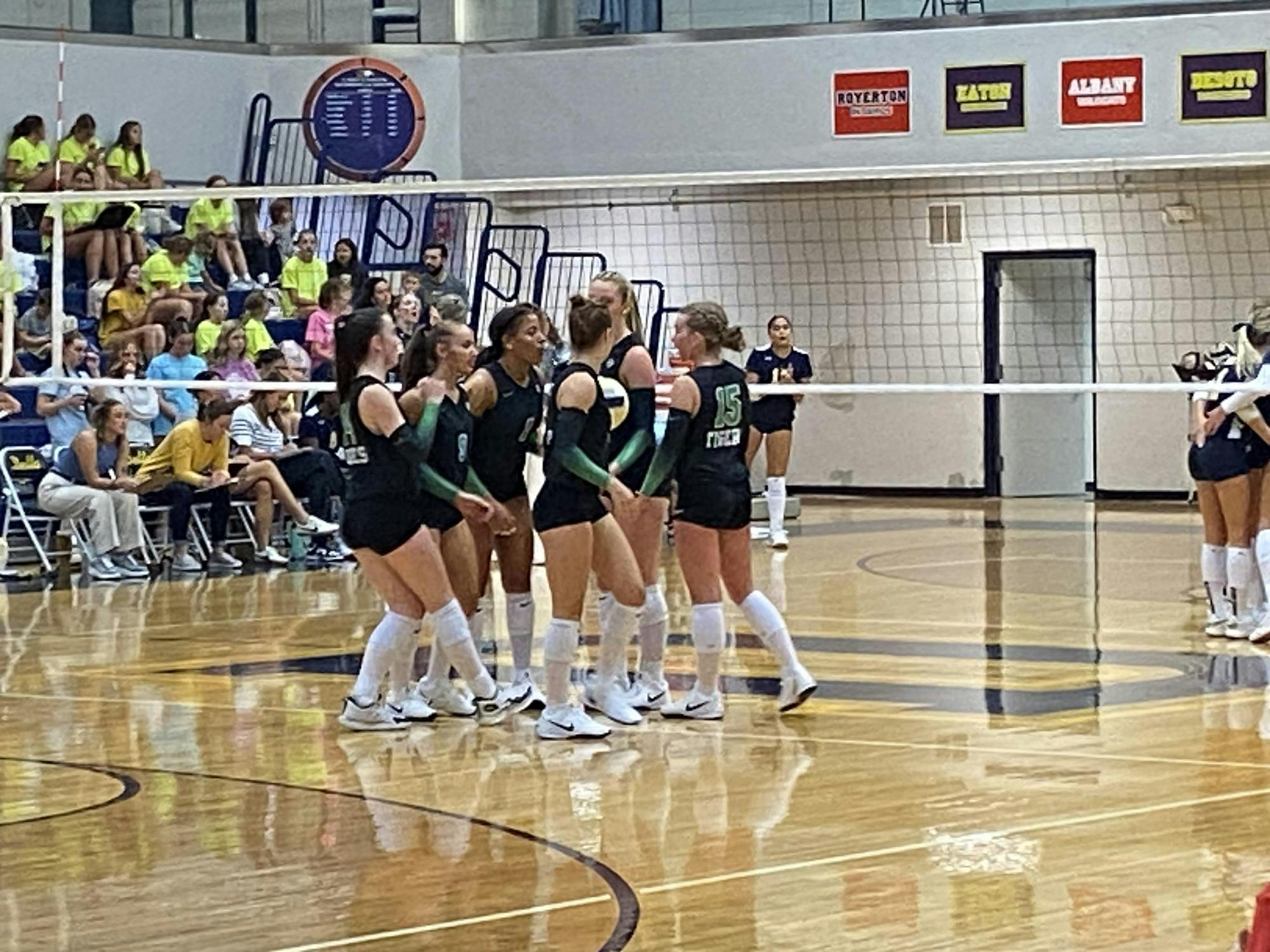 Yorktown players huddle during the match against Delta on Aug 26, 2025. The Tigers swept the Eagles 3-0, highlighted by a dramatic second-set comeback.