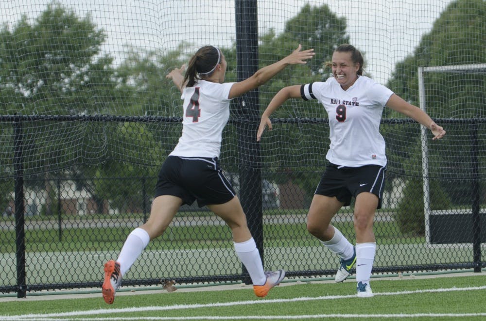 Sophomore midfielder Gabby Veldman and senior forward Nicole Pembleton celebrate after Pembleton scored a goal during the soccer game against Moorehead State on Aug. 31 at the Briner Sports Complex. DN PHOTO BREANNA DAUGHERTY 