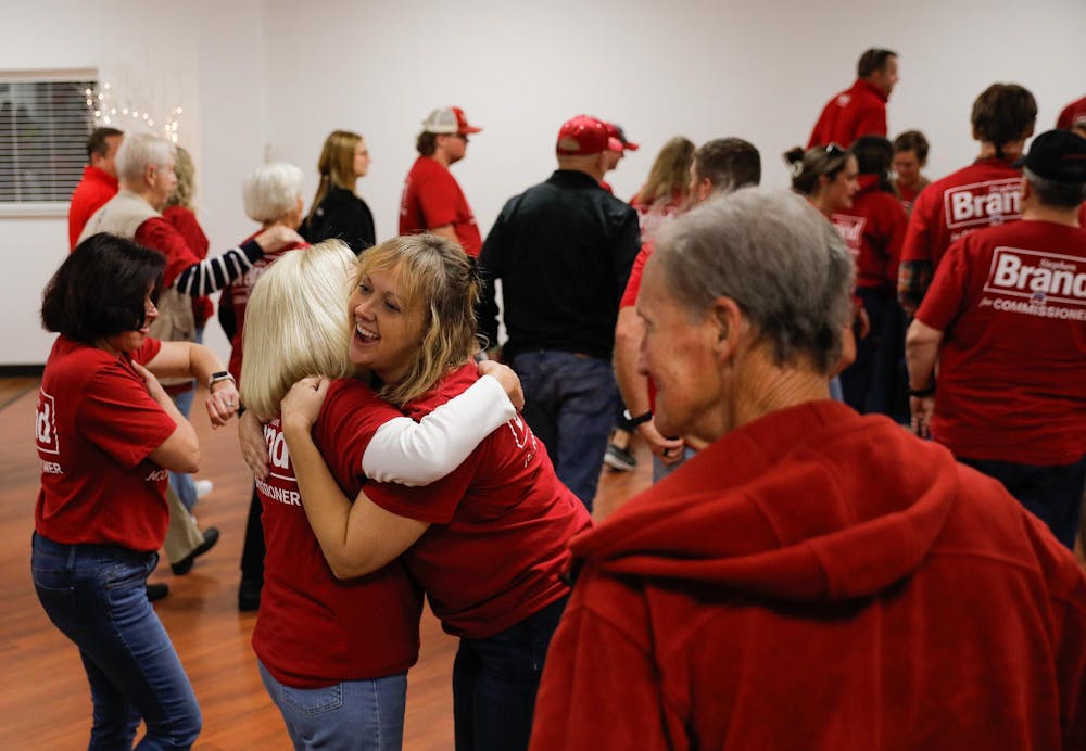 <p>Members of the Deleware County Commissioner Stephen Brand campaign hug during a 2024 election watch party at The Knights of Columbus in Muncie, Ind. Andrew Berger, DN</p>