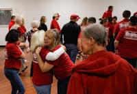 Members of the Deleware County Commissioner Stephen Brand campaign hug during a 2024 election watch party at The Knights of Columbus in Muncie, Ind. Andrew Berger, DN