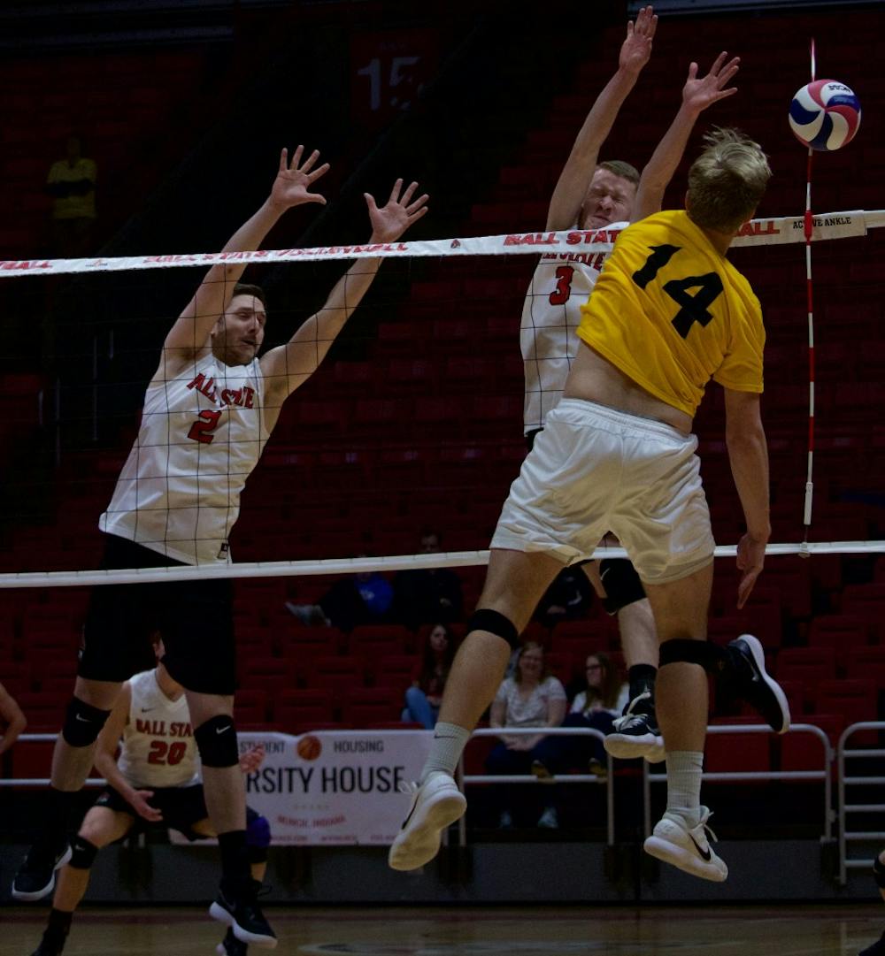 <p>Freshman Ben Chinnci blocks the ball during the third game on March 31 against Quincy at John E. Worthen Arena. Chinnci had five blocks during the three games.<strong> Rebecca Slezak, DN</strong></p>