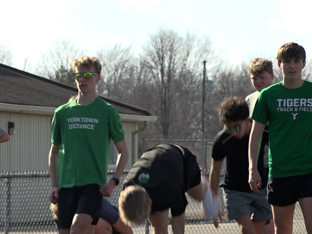 Yorktown distance runners warm up before practice on Feb. 18th.