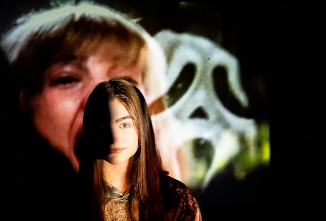 Jayden Vaughn poses for a photo Oct. 18 in the Art and Journalism Building. Jayden expresses how horror movies allow the target of her anxiety to switch off of her and onto the movie she is watching. Isabella Kemper, DN