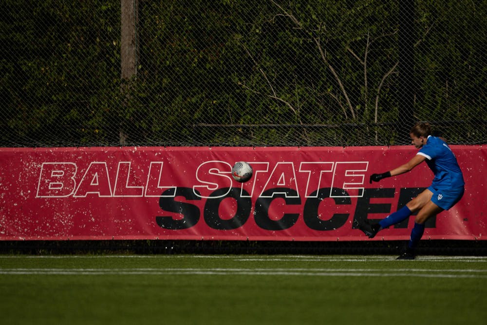 An opposing player from IU Bloomington kicks the ball across the Ball State soccer sign on Aug 20 at Briner Sports Complex. Titus Slaughter, DN 