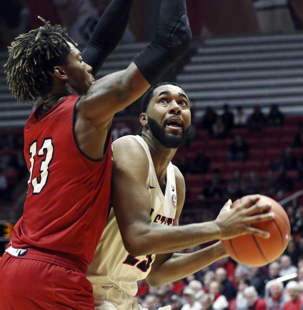 Ball State junior forward Tahjai Teague goes for a layup while being guarded by Miami University sophomore forward Dalonte Brown during the Cardinals' game against the Redhawks Jan. 22, 2019 in John E. Worthen Arena. Teague scored 15 points. Paige Grider, DN