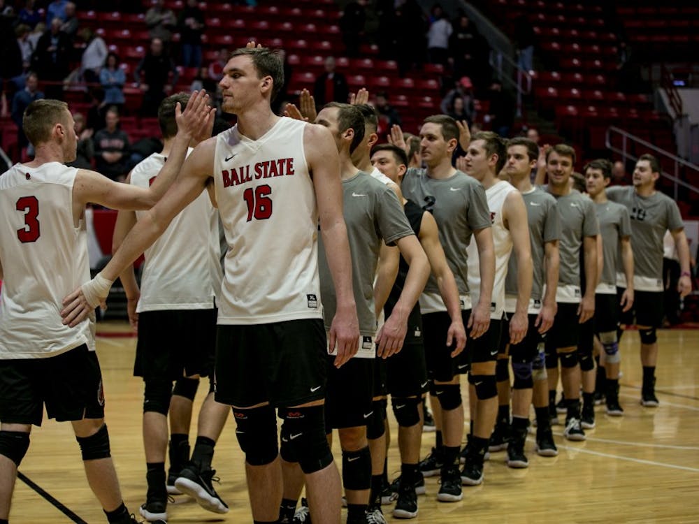 Ball State's mens volleyball team high fives after winning the game against McKendree April 6 in John E. Worthen Arena. The Cardinals won 3-0. Kaiti Sullivan, DN