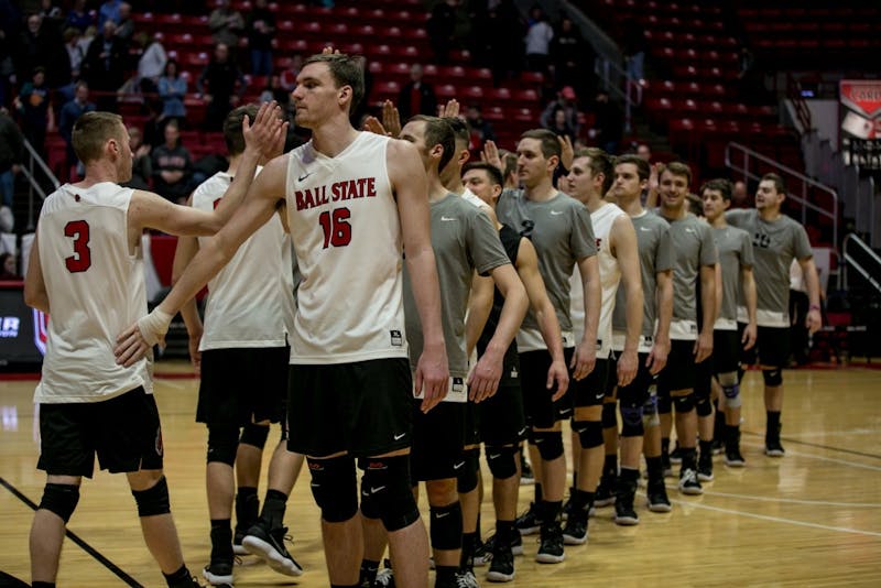 Ball State's mens volleyball team high fives after winning the game against McKendree April 6 in John E. Worthen Arena. The Cardinals won 3-0. Kaiti Sullivan, DN