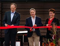 During the ceremony opening of the Brown Family Amphitheater, donor Charles Brown cuts the ribbon with other members from the Board of Trustees and President Geoffrey Mearns. The ceremony was followed by a free jazz concert. Kate Farr, DN