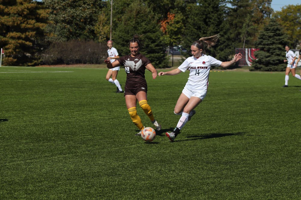 <p>Fifth-year midfielder Sammi Corcoran fights for the ball against number 19 on the opponent team, Eastern Michigan, in the first half of the game on Oct. 9 at Brinner Sports Complex. Eve Green, DN</p>