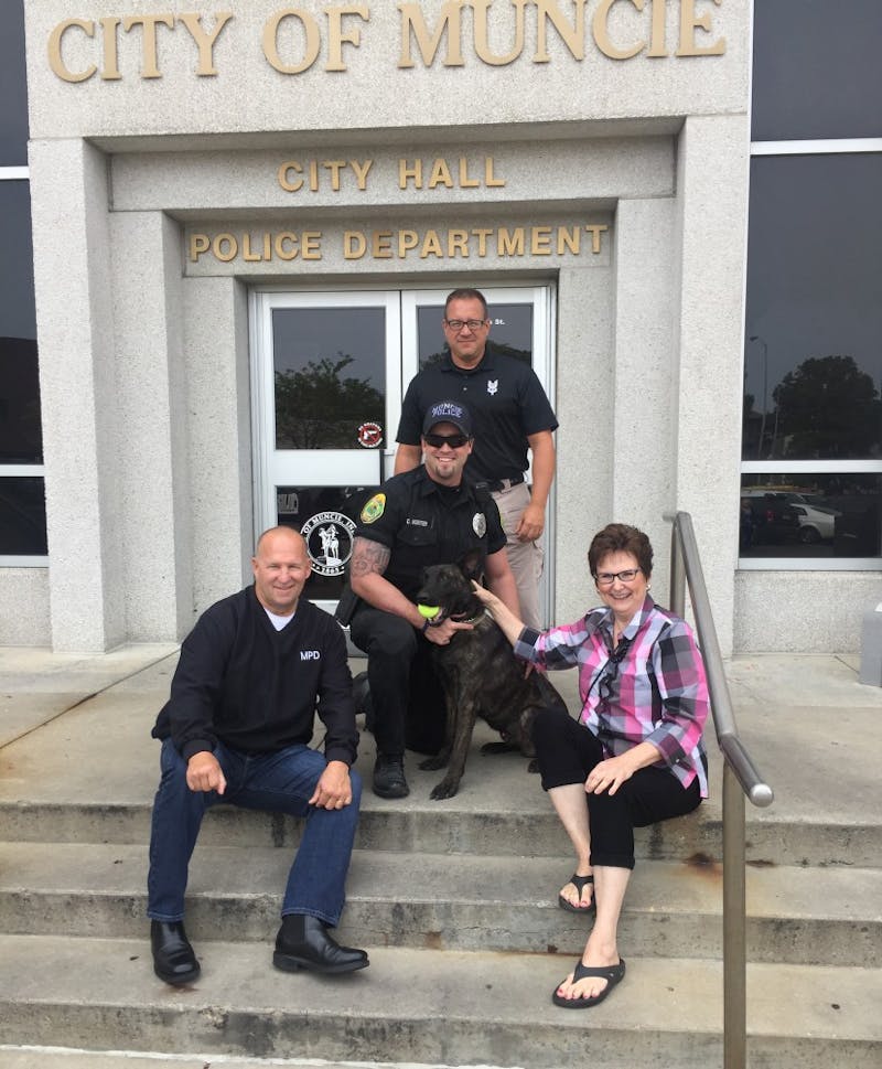 Donna Maitlen (right) meets the K9 officer she purchased for the Muncie Police Department. K9 Rasse is currently training with his handler, Patrolman Chase Hunter. Chase Winkle, Photo Provided