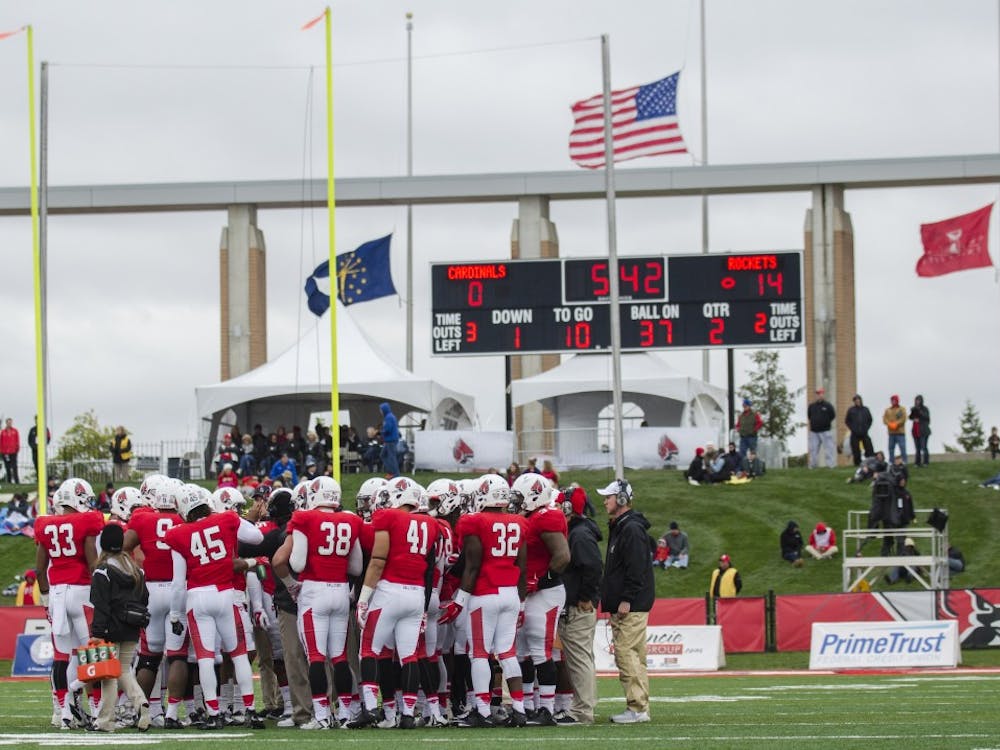 The Ball State football team huddles up during the second quarter in the game against Toledo on Oct. 2 at Scheumann Stadium. Ball State lost 24-10. DN PHOTO BREANNA DAUGHERTY
