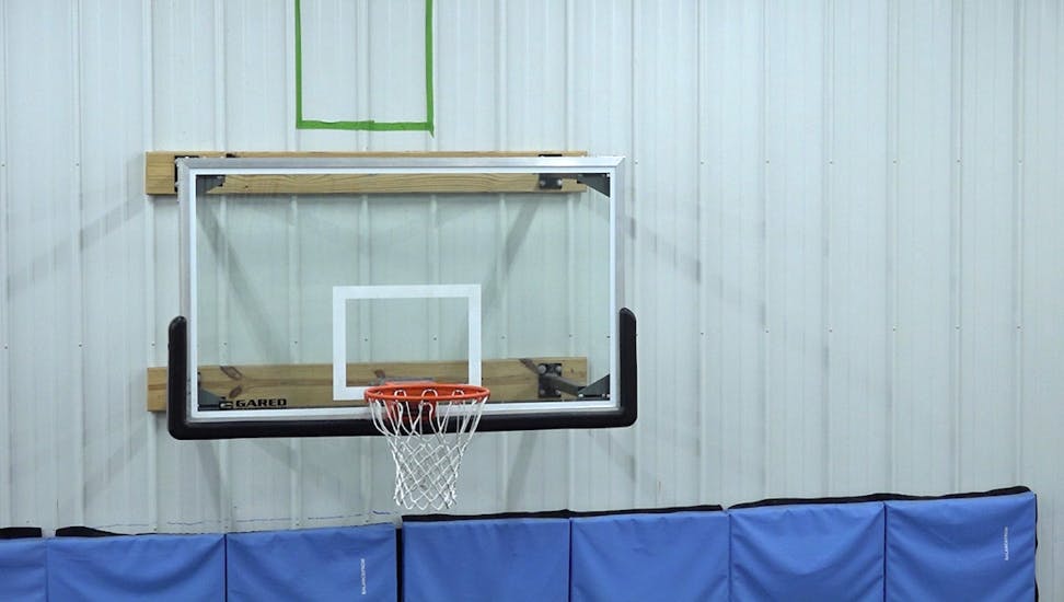 Basketball hoop located at Next Pro, Dennis Trammell’s gym. 
