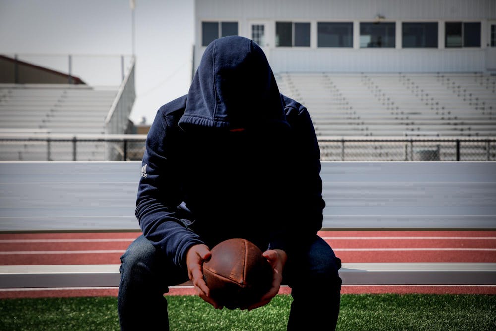 An athlete sits on the bench Sept. 10 at Wes-Del Junior High School. A large part of the emphasis in Wapahanis’ program begins with first connecting with the student-athletes off the field. Andrew Berger, DN 
