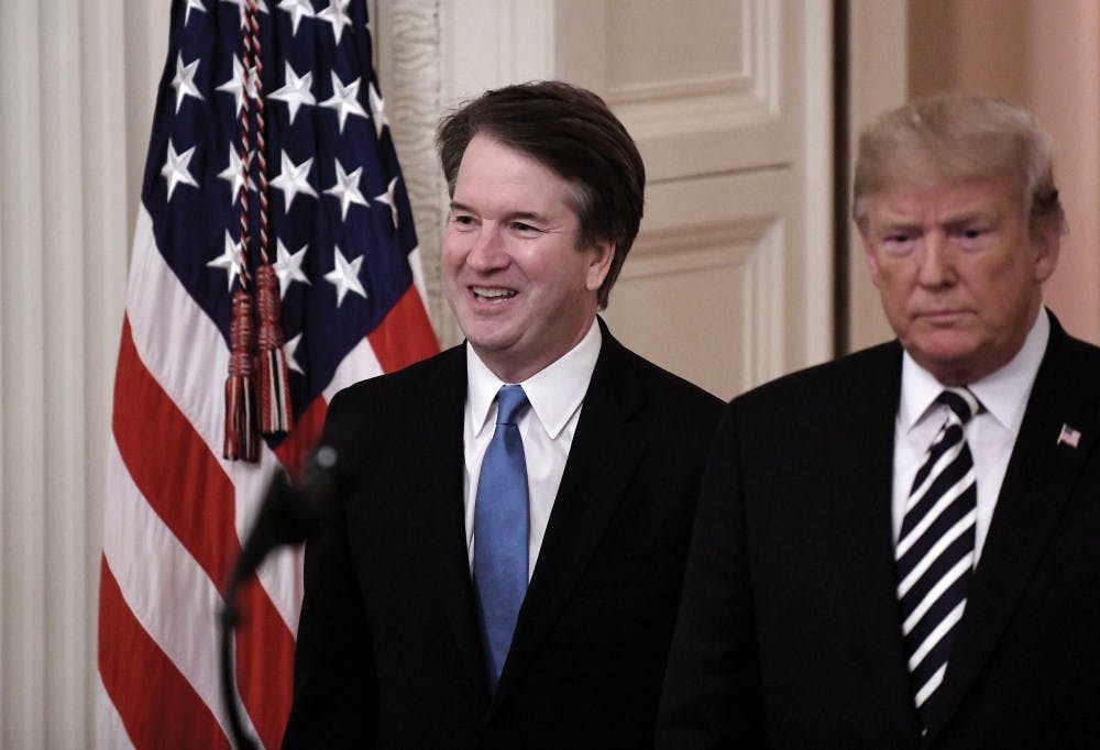 President Donald Trump, right, and Brett Kavanaugh, associate justice of the Supreme Court, arrive at a ceremonial swearing-in event in the East Room at the White House in Washington, D.C., on Monday, Oct. 8, 2018. Olivier Douliery/Abaca Press/TNS, PHOTO PROVIDED
