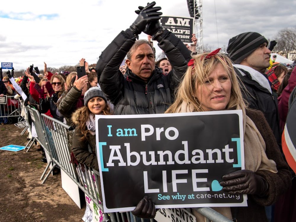 Mary Kolar, 58, from Tequesta, Fla., listens to Vice President Mike Pence as thousands of pro-life marchers crowd the streets near the National Mall during the March for Life Friday, Jan. 27, 2017 in Washington, D.C. (Ken Cedeno/McClatchy Washington Bureau/TNS) 