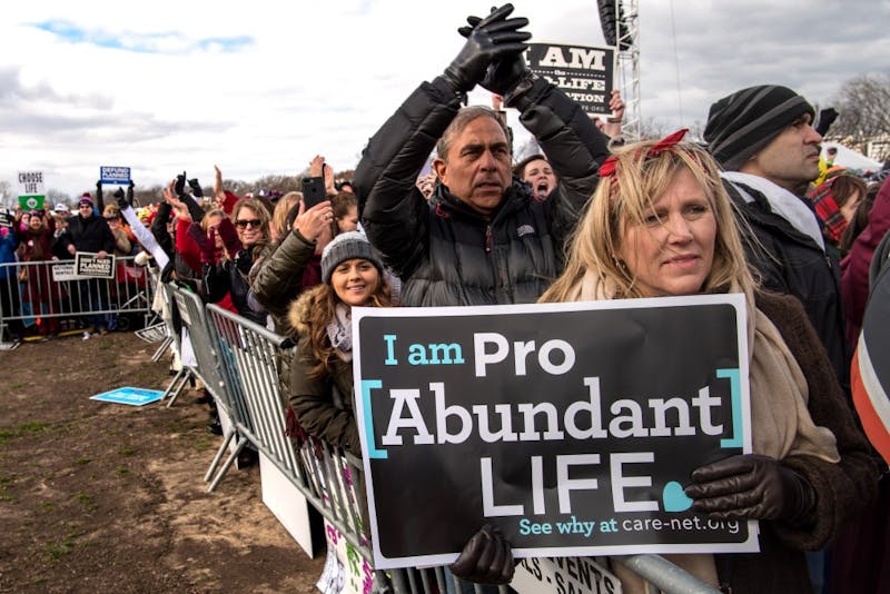 Mary Kolar, 58, from Tequesta, Fla., listens to Vice President Mike Pence as thousands of pro-life marchers crowd the streets near the National Mall during the March for Life Friday, Jan. 27, 2017 in Washington, D.C. (Ken Cedeno/McClatchy Washington Bureau/TNS) 