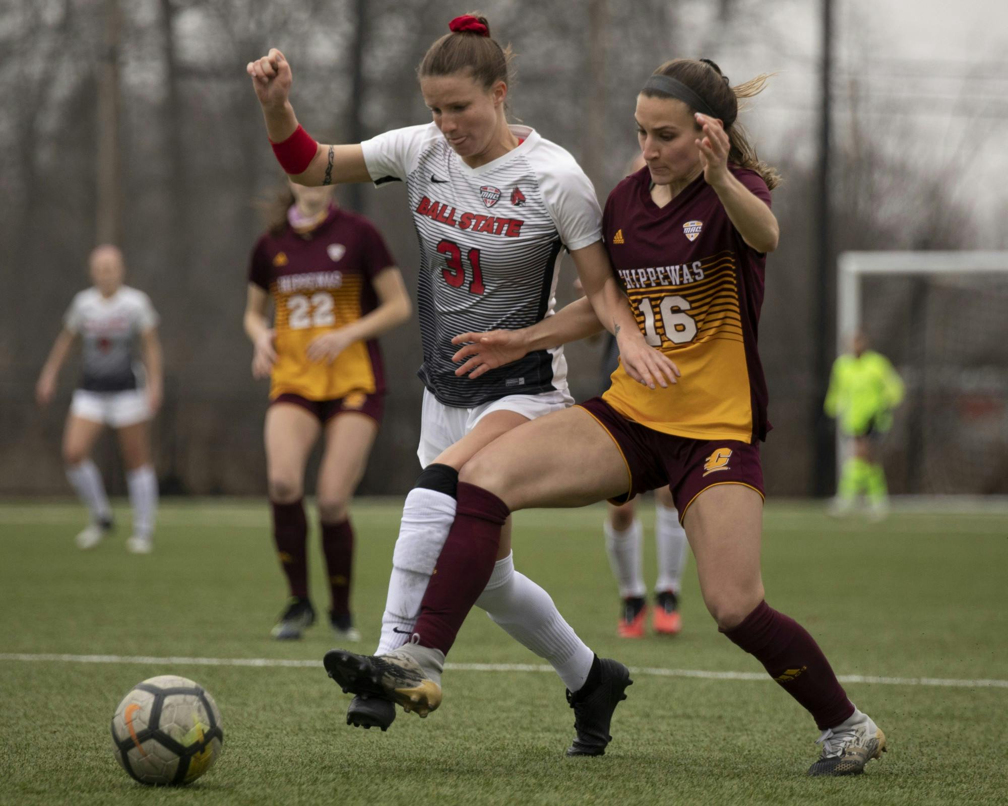 Cardinals junior midfielder Tatiana Mason and Chippewas senior defender battle for the ball March 26, 2021, at Briner Sports Complex. The Cardinals won 2-1 in overtime. Jacob Musselman, DN
