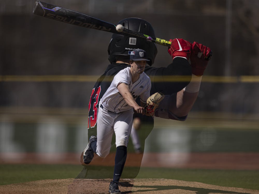Bulldogs senior pitcher Jack Myers throws a pitch to Cardinals senior outfielder Ross Messina April 2, 2021, at Bulldog Park in Indianapolis, Indiana. The Cardinals beat the Bulldogs 7-2. Jacob Musselman, DN