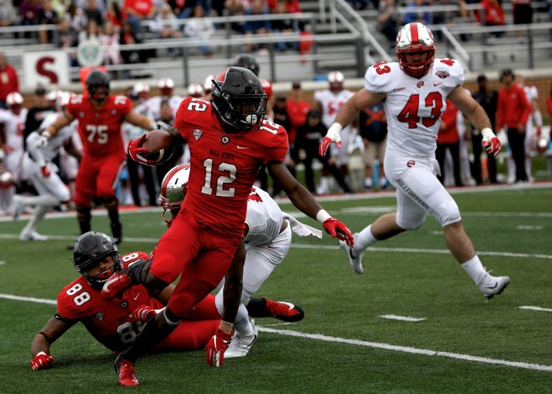 Sophomore wide receiver Justin Hall runs the ball up the field against Western Kentucky Sept. 22, 2018, at Scheumann Stadium. Hall had 60 receiving yards. Rebecca Slezak,DN