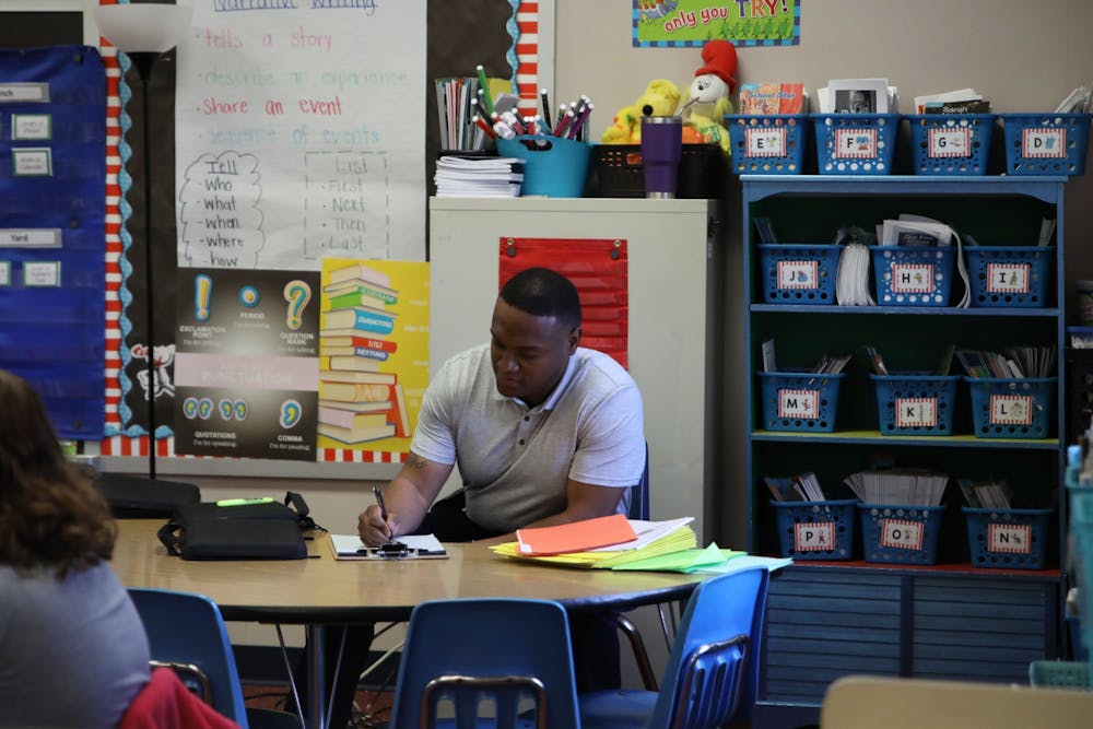 <p>Rahmed Paige completes a classroom observation with Mrs. Gariety’s second grade class April 7 at Grissom Elementary School. Classroom observations are one of Paige’s responsibilities as a family navigator at Grissom. <strong>Amber Pietz, DN</strong></p>