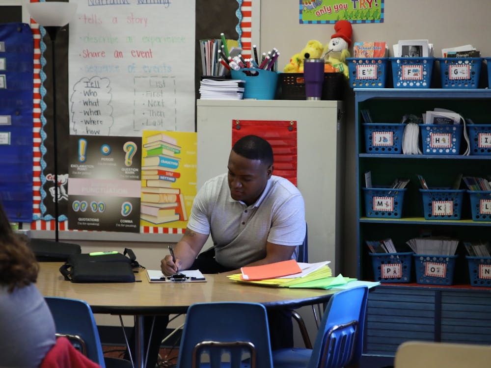 Rahmed Paige completes a classroom observation with Mrs. Gariety’s second grade class April 7 at Grissom Elementary School. Classroom observations are one of Paige’s responsibilities as a family navigator at Grissom. Amber Pietz, DN