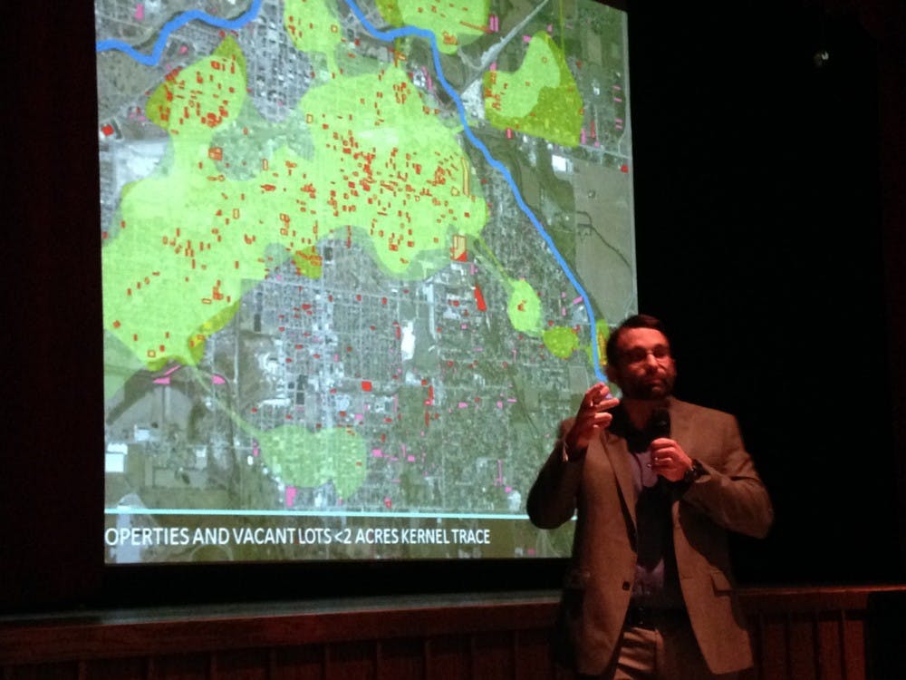 Colby Gray, a member of the committee, speaks about the concentration of vacant properties in Muncie. DN PHOTO KARA BERG