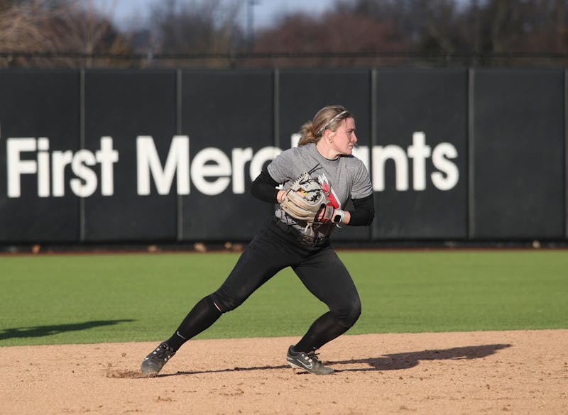 Redshirt sophomore utility player McKenna Mulholland moves to throw Feb. 13 during a practice at the softball field at the First Merchants Ballpark Complex. Zach Carter, DN.