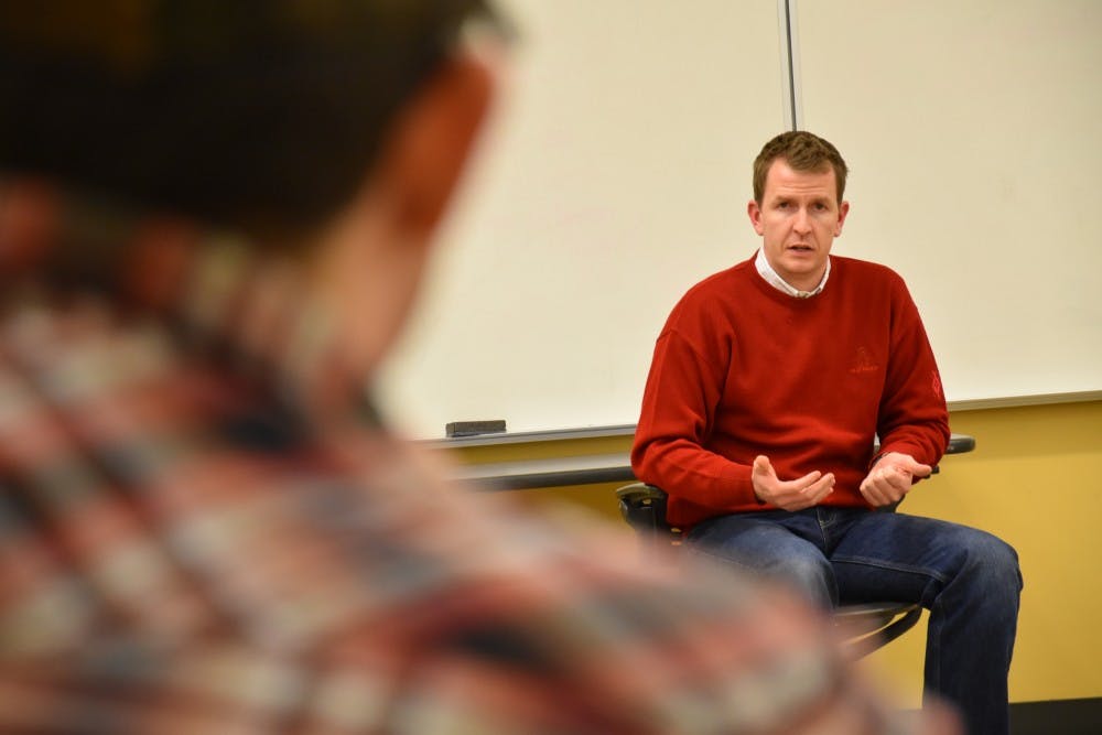<p>Adam Berry, a co-founder of PoliticalBank, speaks to a member of the Ball State College Republicans on Feb 9. He worked with Mike Pence during his campaign in the gubernatorial race and as a regulatory policy director in Pence's administration. Patrick Calvert // DN Photo</p>
