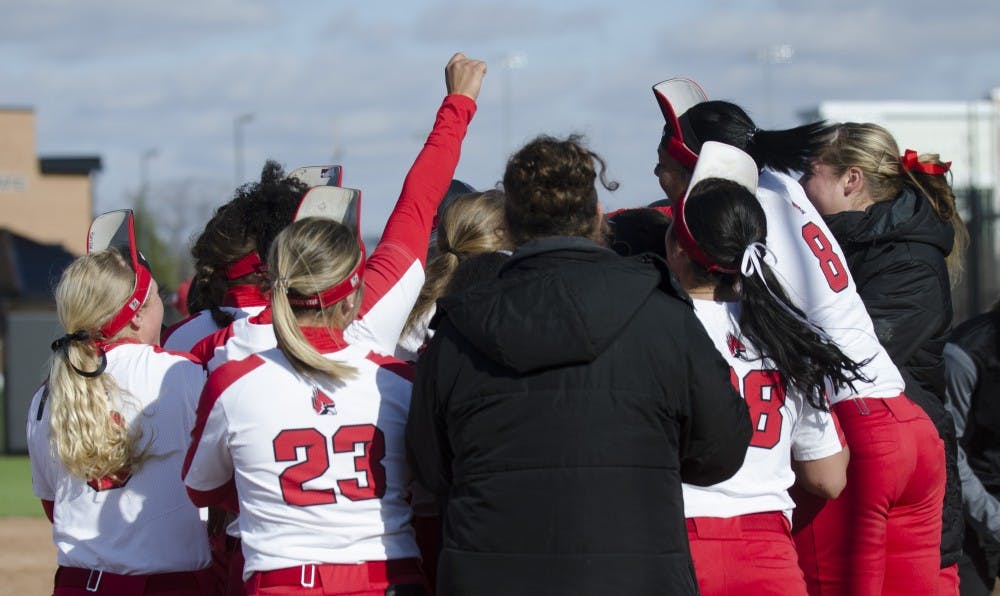 Ball State meets senior center fielder Rachel Houck at homeplate after she hit a walk-off homerun during the second game of the double-header against Miami University on April 1 at the First Merchants Ballpark Complex. Ball State won the game 3-1. Emma Rogers // DN