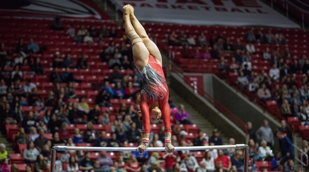 <p>Senior Baylee Bell competes at bar during the meet against Kent State Jan. 28 in John E. Worthen Arena. <strong>Kaiti Sullivan, DN</strong></p>