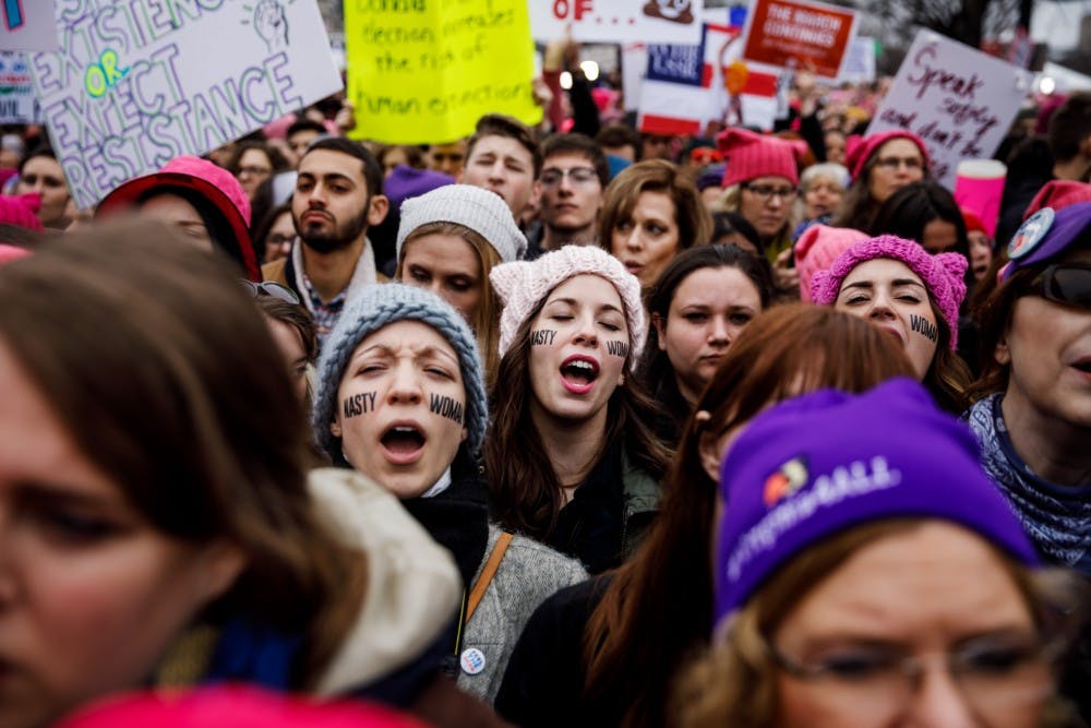 Women sing along as thousands pack the streets for the Women's March on Washington rally outside the National Museum of the American Indian in Washington, D.C., on Saturday, Jan. 21, 2017. (Marcus Yam/Los Angeles Times/TNS)
