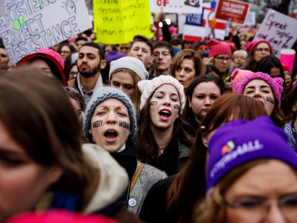 Women sing along as thousands pack the streets for the Women's March on Washington rally outside the National Museum of the American Indian in Washington, D.C., on Saturday, Jan. 21, 2017. (Marcus Yam/Los Angeles Times/TNS)