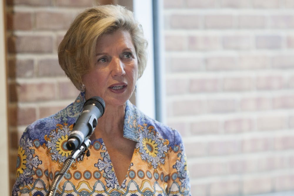 President Jo Ann Gora speaks to donors, alumni, coaches and players during the groundbreaking ceremony for the Ronald E. and Joan M. Venderly Football Team Complex. DN PHOTO JORDAN HUFFER