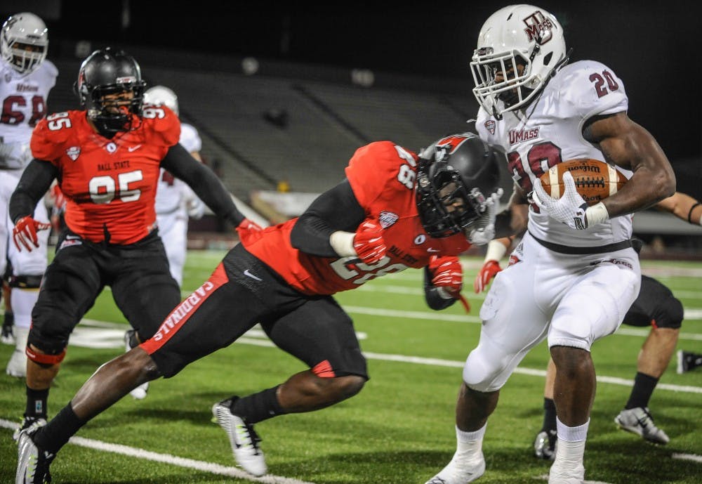 Senior defensive back Gilbert Stlouis attempts to tackle a University of Massachusetts player on Nov. 12 at McGuirk Stadium. Courtesy of James Jesson/The Massachusetts Daily Collegian