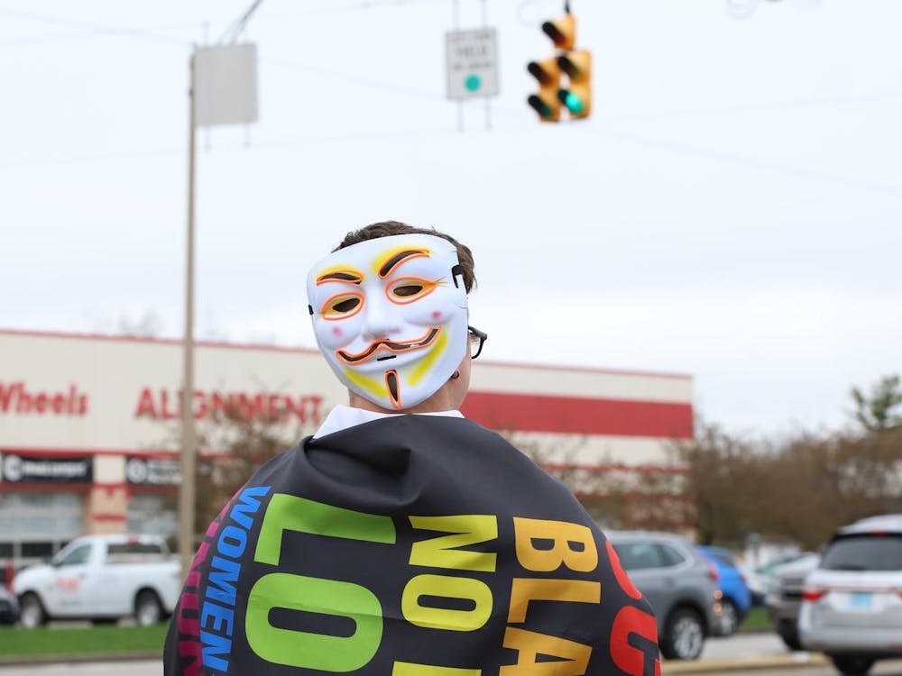 Lining the streets of the Wheeling Avenue and McGalliard Road intersection, anti-Trump protesters chanted and held signs expressing their concerns over the Trump administration Saturday, April 5. The protest, organized by Muncie Resists, was part of a nationwide protest campaign, called “Hands Off.” Representatives from Muncie Resists suspected over 400 people were in attendance. 