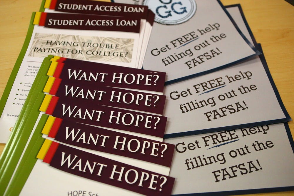 Materials for participants sit on a table at a financial aid workshop in conjunction with the Georgia Student Finance Commission to help parents and students with questions about the FAFSA at Banneker High School on Thursday, Feb 19, 2015, in College Park, Ga. (Curtis Compton/Atlanta Journal-Constitution/TNS) 