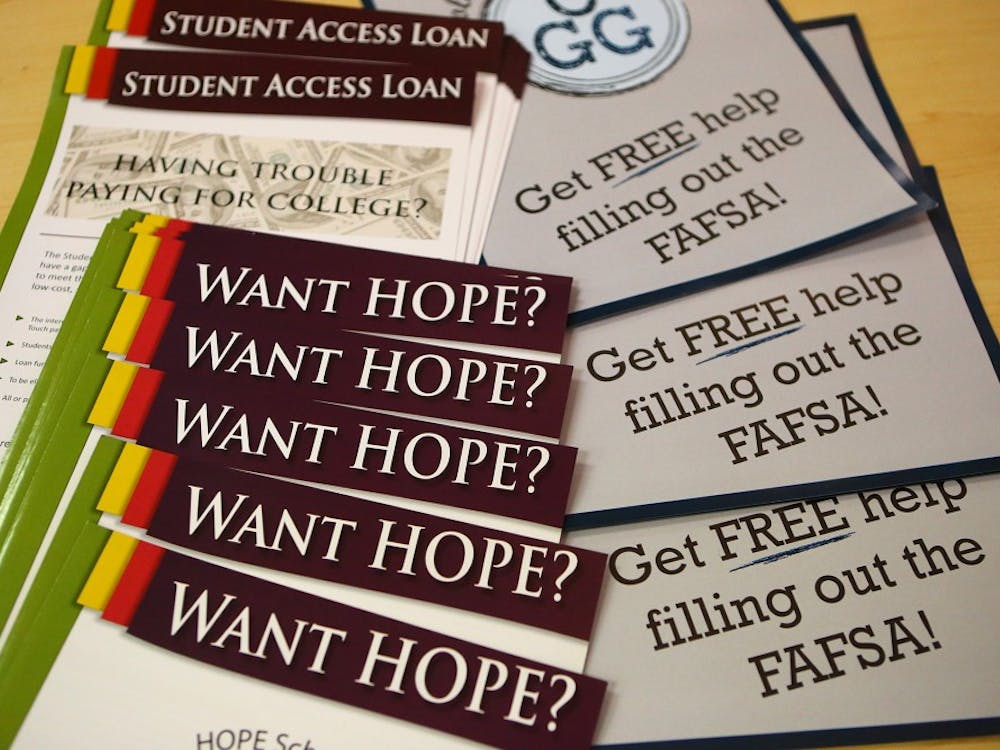Materials for participants sit on a table at a financial aid workshop in conjunction with the Georgia Student Finance Commission to help parents and students with questions about the FAFSA at Banneker High School on Thursday, Feb 19, 2015, in College Park, Ga. (Curtis Compton/Atlanta Journal-Constitution/TNS)