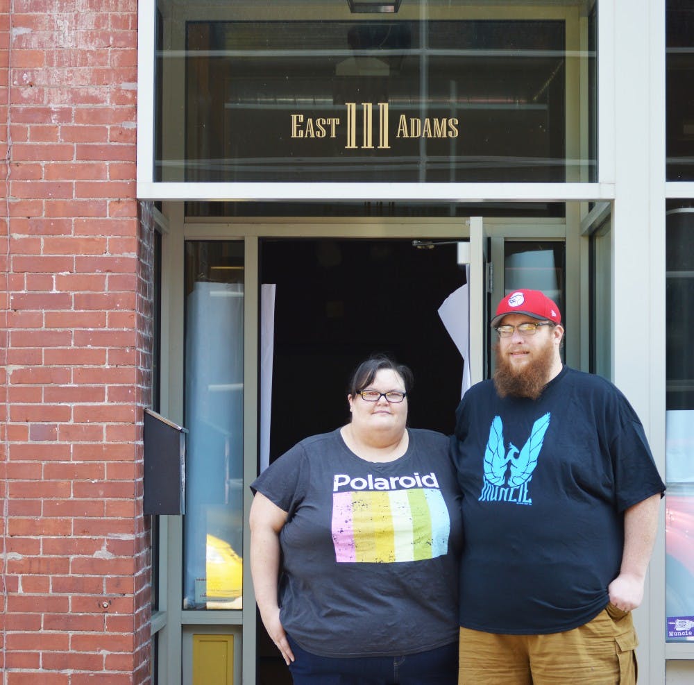 <p>Ball State alumnus Andy Shear and his wife Amy work daily to finish setting up their new store at 111 E. Adams St. Both hope to welcome guests and join the Muncie community Sept. 6. <strong>Tier Morrow, DN</strong></p>