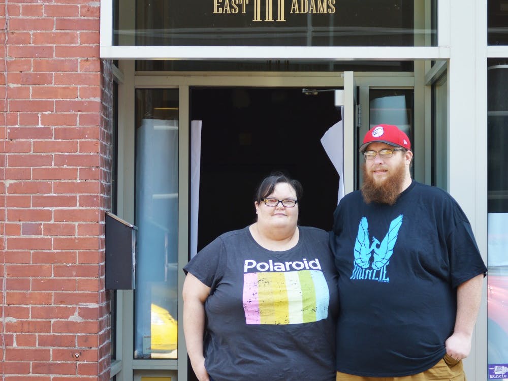Ball State alumnus Andy Shear and his wife Amy work daily to finish setting up their new store at 111 E. Adams St. Both hope to welcome guests and join the Muncie community Sept. 6. Tier Morrow, DN