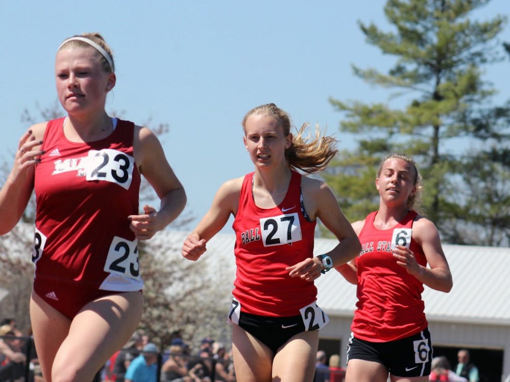 Freshmen Jessica Bryzek (left) and Kitty Taylor compete in the women's 5,000 meter run at the Ball State Challenge at the Briner Sports Complex on Saturday, April 16, 2016. DN PHOTO ALLYE CLAYTON