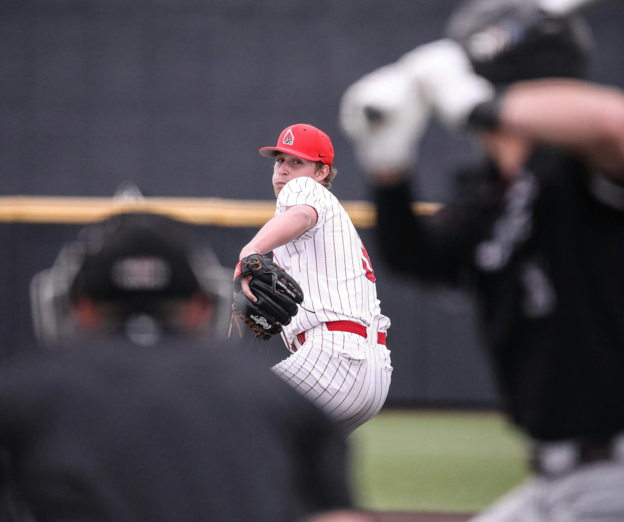 Sophomore pitcher Logan Schulfer pitches in a game against Bellarmine on April 4 at First Merchants Ballpark Complex. Schulfer had a career-high eight strikeouts. Katelyn Howell, DN