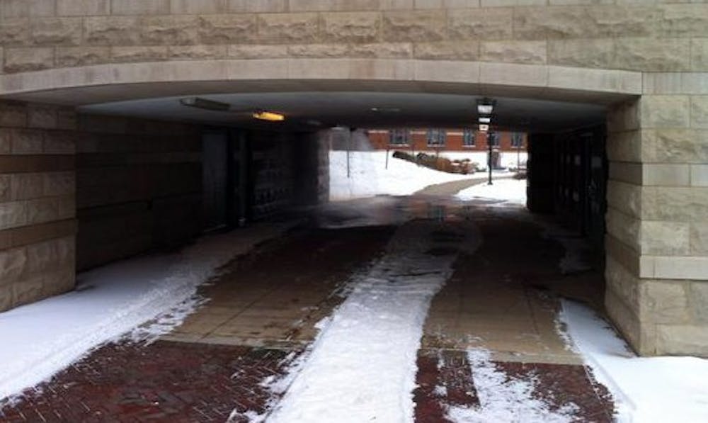 Water pours from a light fixture in an outdoor tunnel at Park Hall Jan. 25. A fire alarm went off at the same time, forcing students to evacuate the residence hall. PHOTO COURTESY OF CODY BUTLER