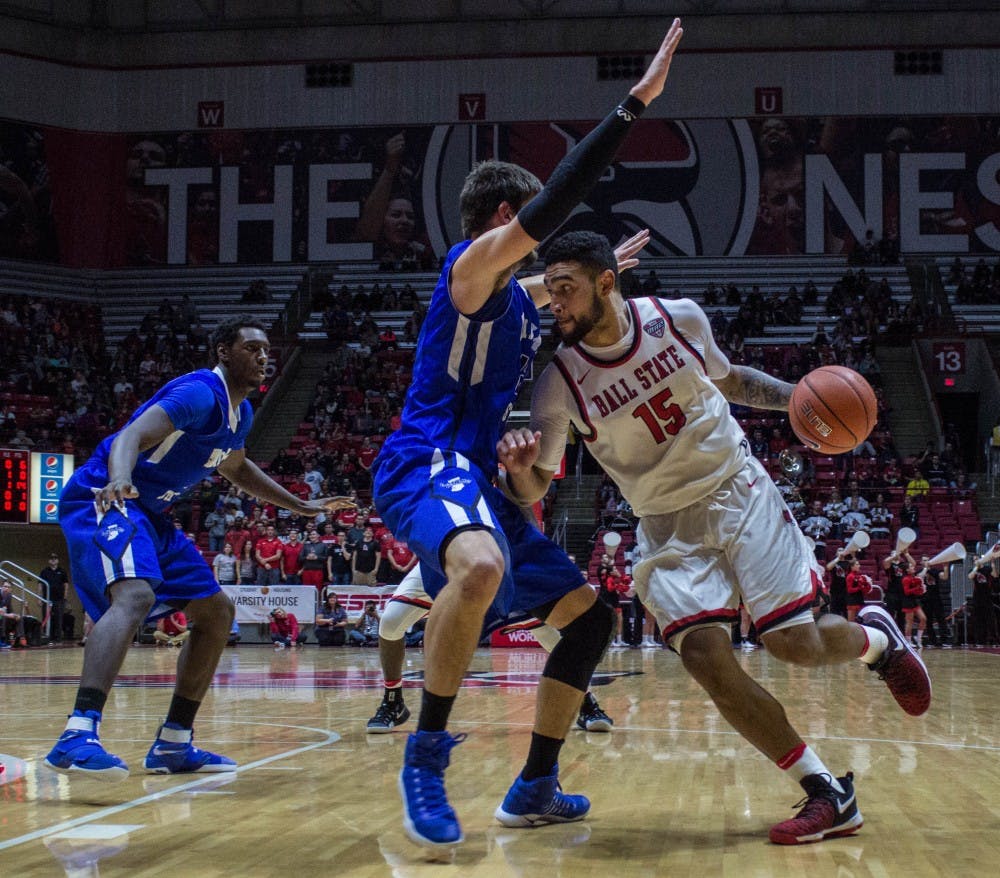 Ball State's forward Franko House attempts to push past Indiana State's players during the game on Nov. 15 in Worthen Arena. The Cardinals lost 74-80. Grace Ramey // DN
