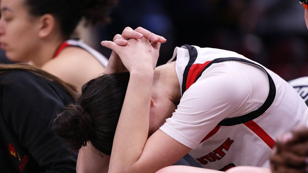 Senior Estel Puiggros hangs her head as she watches her teammates play against Kent State March 15 at Rocket Mortgage FieldHouse. The Cardinals lost 65-50 against the Golden Eagles. Mya Cataline, DN